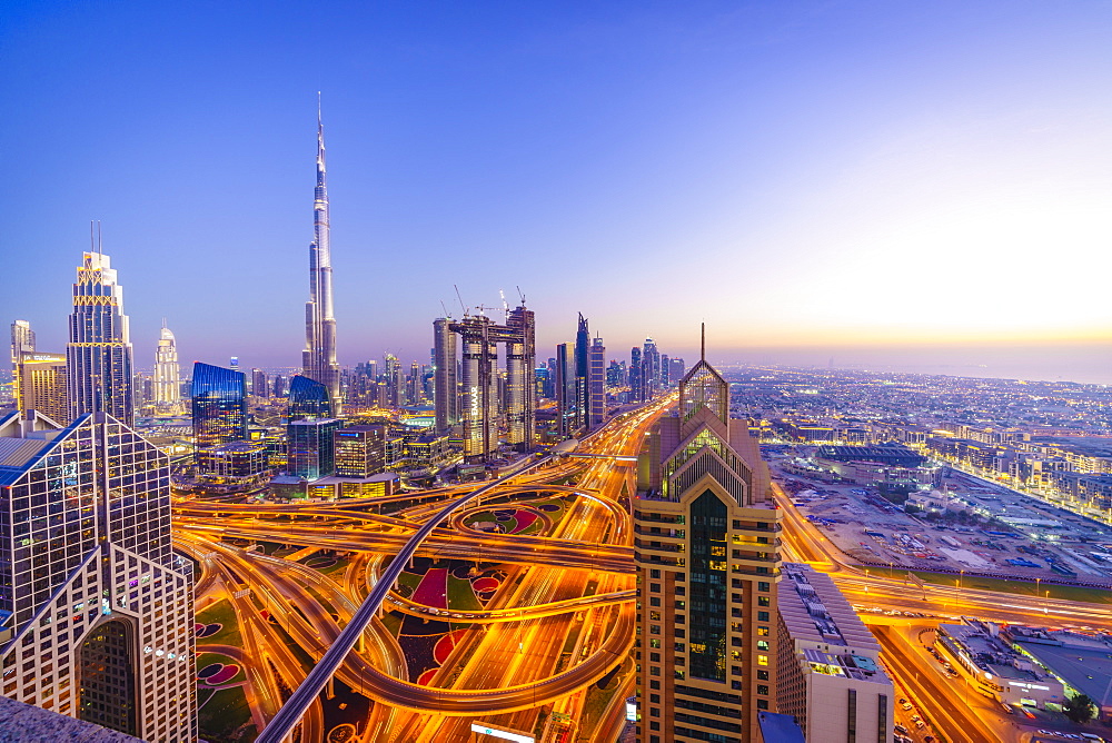 Dubai skyline with Burj Khalifa and Sheikh Zayed Road Interchange, Dubai, United Arab Emirates, Middle East