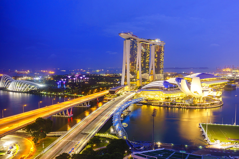 Busy roads leading to the Marina Bay Sands, Gardens by the Bay and ArtScience Museum at night, Singapore, Southeast Asia, Asia