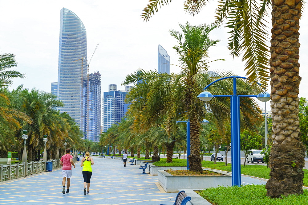 Joggers on the Corniche, Abu Dhabi, United Arab Emirates, Middle East