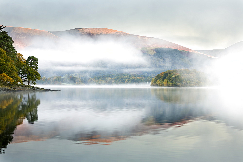 Mist over Derwent Water at dawn, from Brandlehow, Borrowdale, The Lake District National Park, Cumbria, England, United Kingdom, Europe