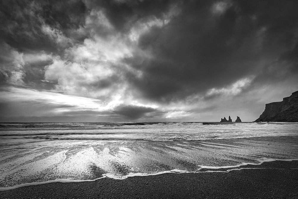 Sea stacks, tall cliffs and black basalt sandy beach at Vic on the southern coast, Iceland, Polar Regions