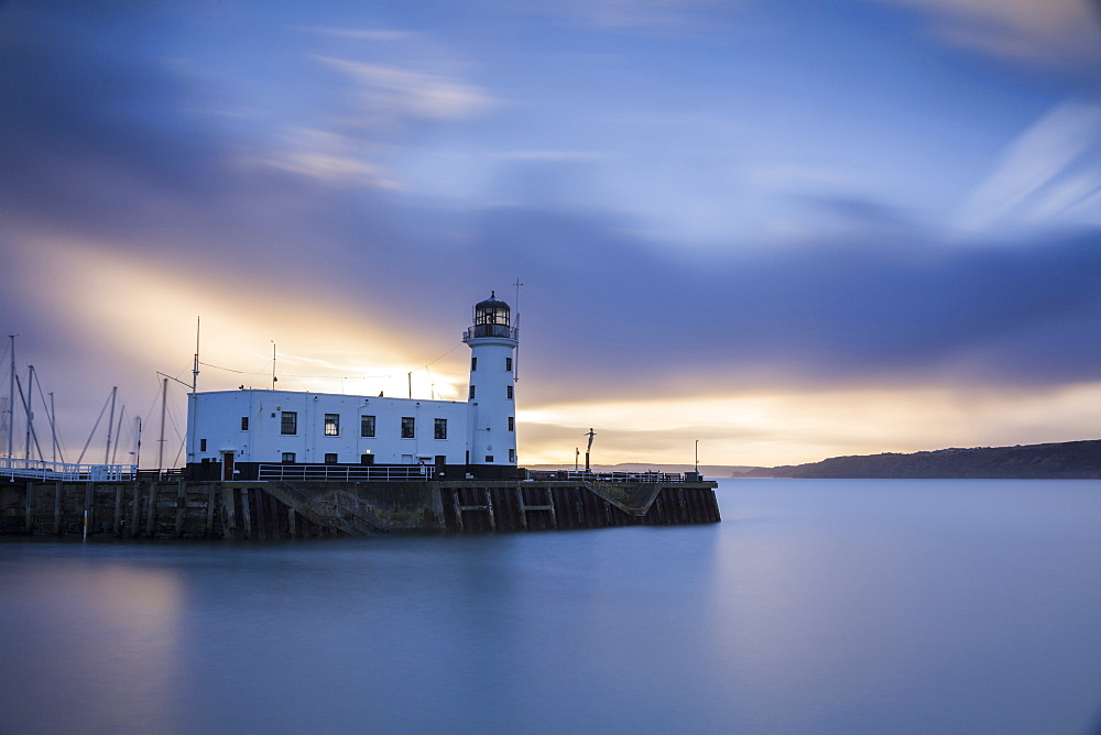 A long exposure photograph of Scarborough Lighthouse shortly after sunrise, Scarborough, North Yorkshire, Yorkshire, England, United Kingdom, Europe