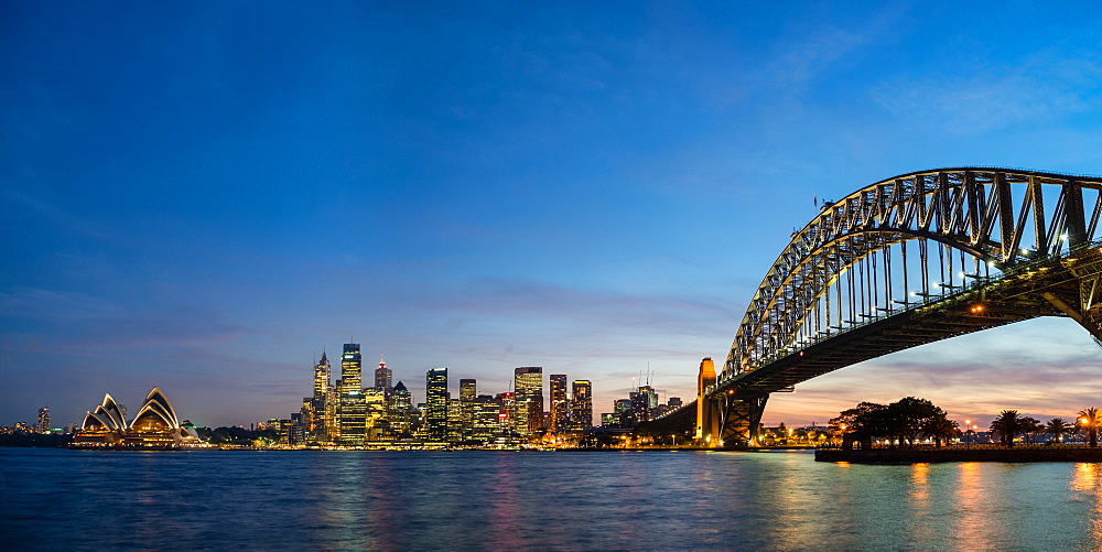 Sydney's iconic buildings lit up as dusk settles over the city, Sydney, New South Wales, Australia, Pacific