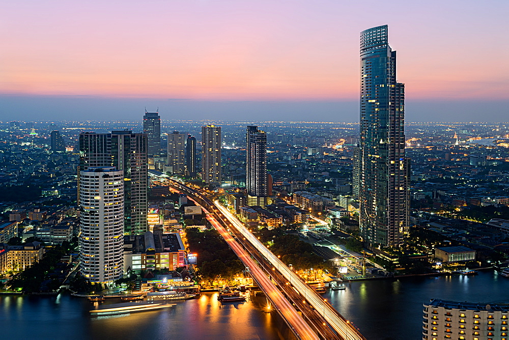 Light trails and skyscrapers at dusk, Bangkok, Thailand, Southeast Asia, Asia