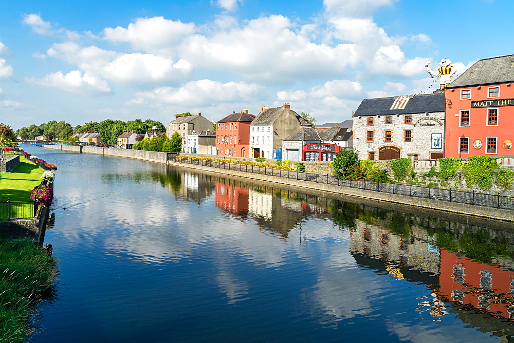 Homes line a canal in Kilkenny, County Kilkenny, Leinster, Republic of Ireland, Europe