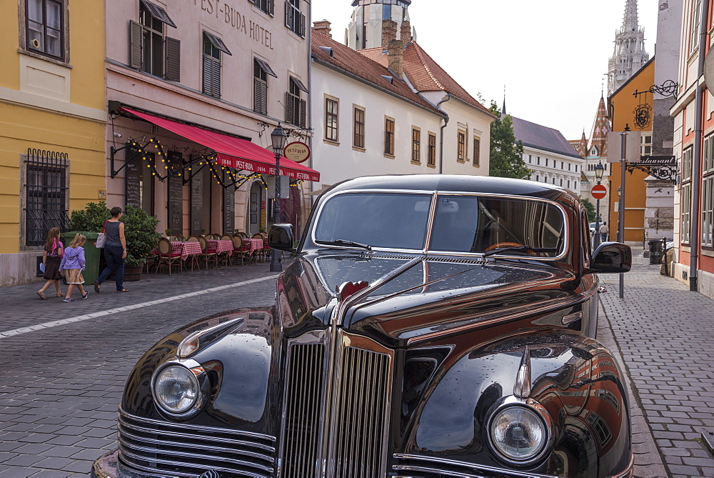 Antique car and Pest-Buda Restaurant near the Fisherman's Bastion, Budapest, Hungary, Europe