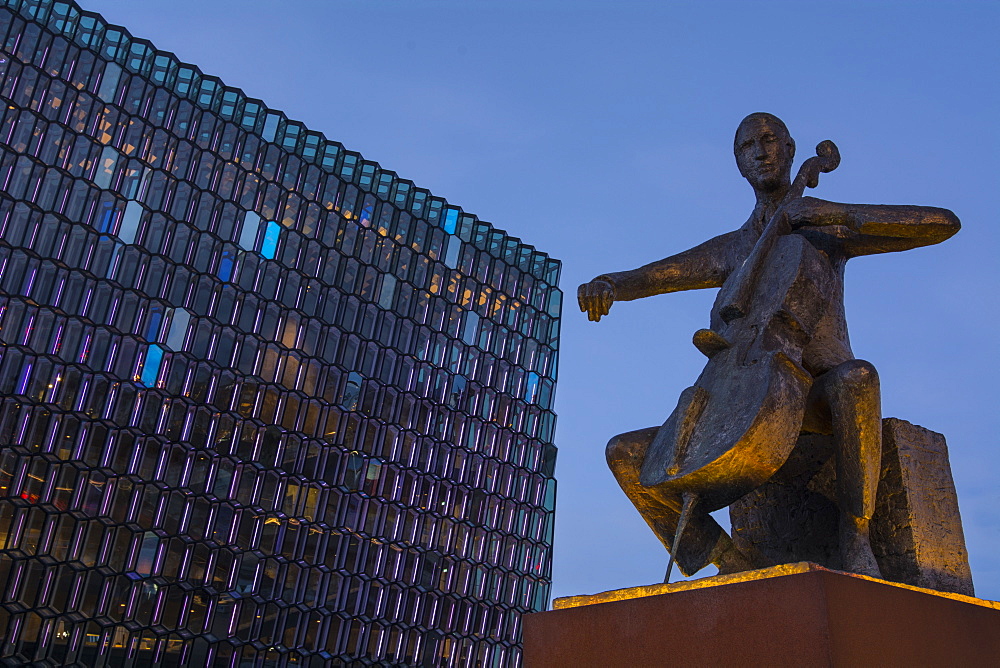 Statue of Danish cellist Erling Blondal Bengtsson, by sculptor Olof Palsdottir, and the Harpa Concert Hall, Reykjavik, Iceland, Polar Regions