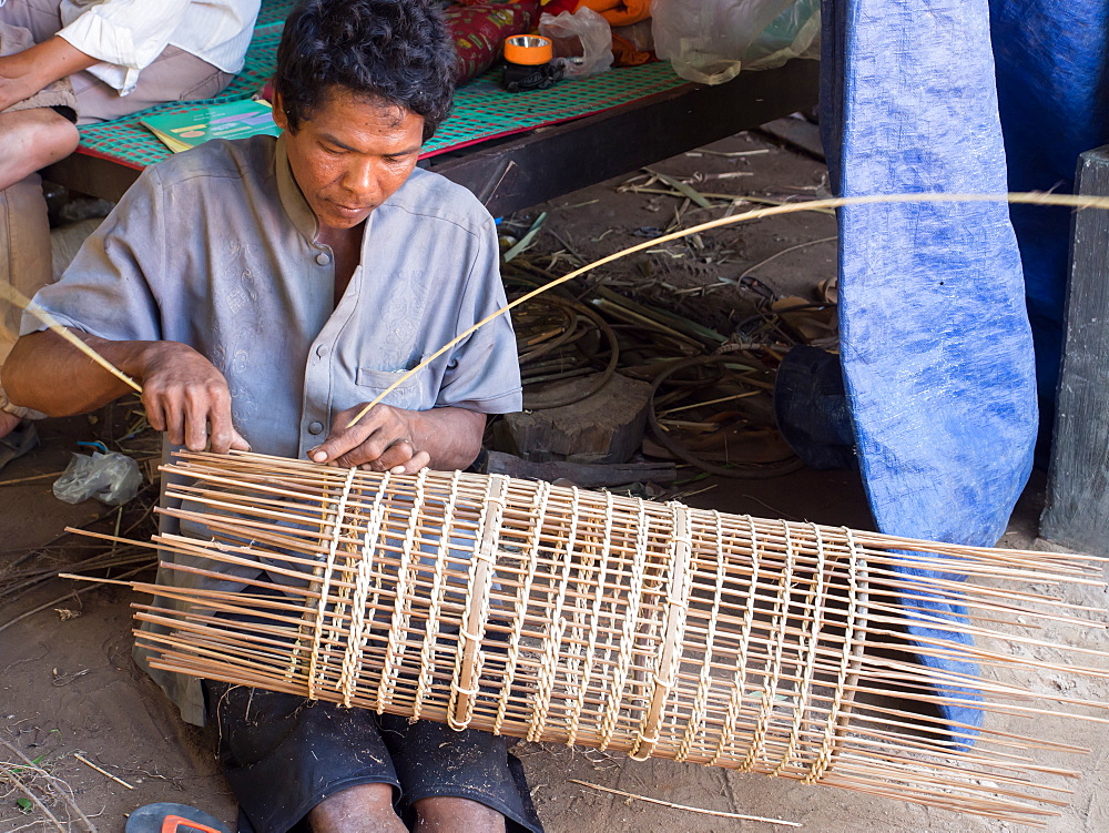 Man making a fish trap, village near Siem Reap, Cambodia, Indochina, Southeast Asia, Asia