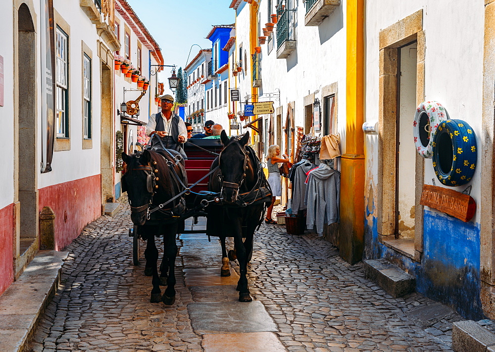 Horse-drawn carriage within the ancient fortified village of Obidos, Oeste Leiria District, Portugal, Europe