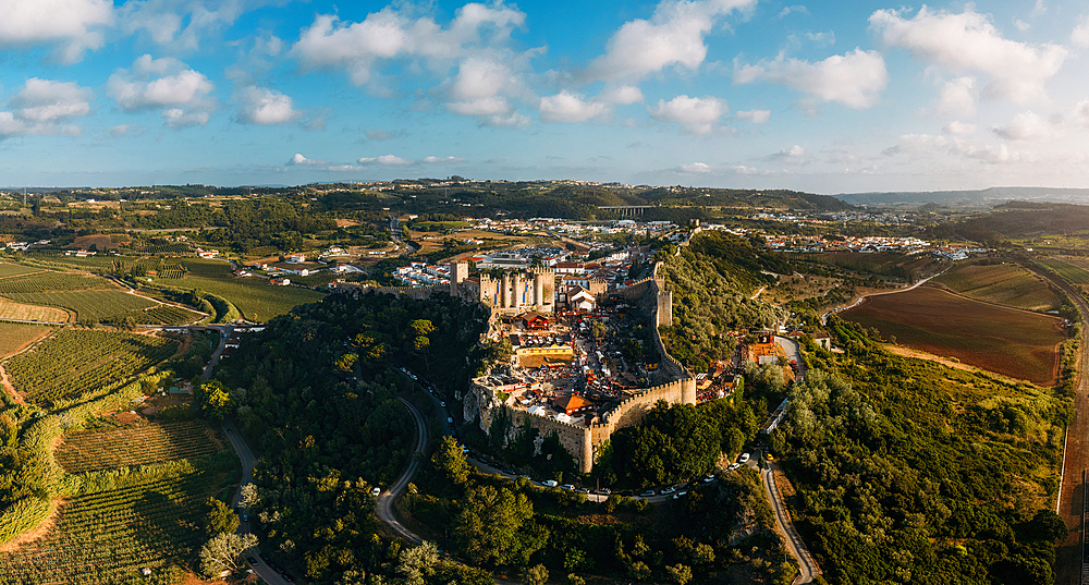 Aerial panoramic view of the famous July Medieval Fair festival in Obidos, a UNESCO World Heritage Site as a Creative City of Literature, Obidos, Leiria, Portugal, Europe