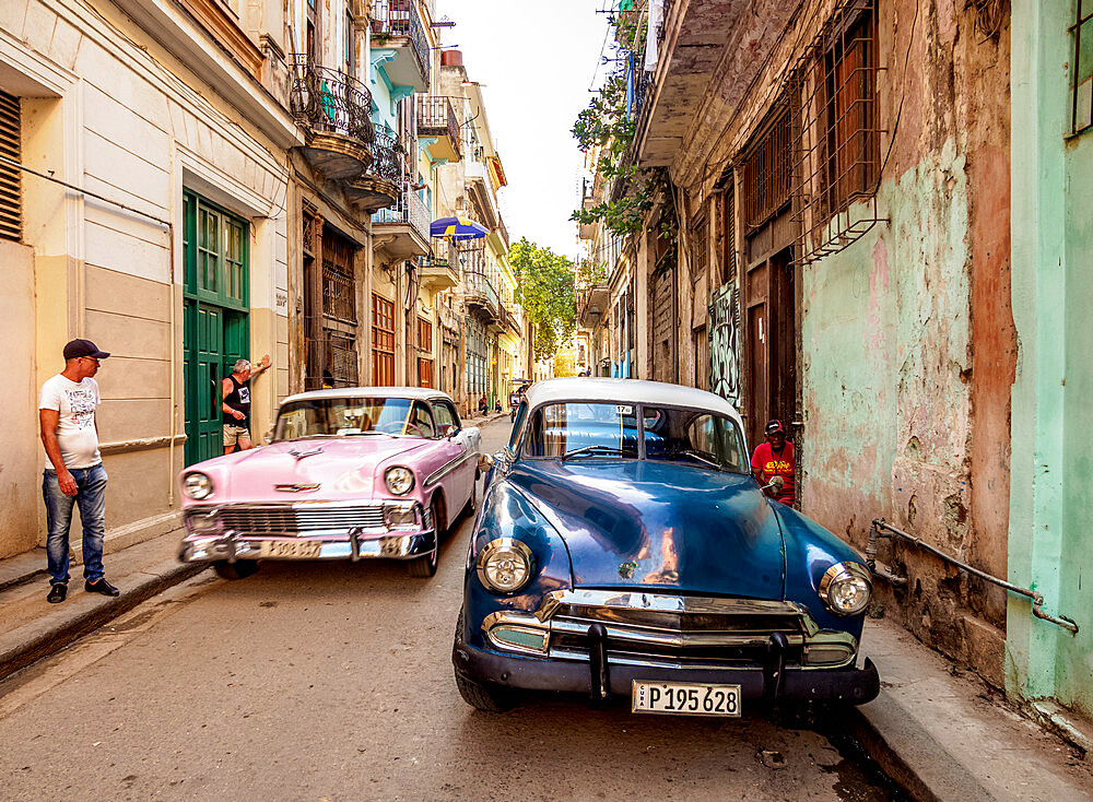 Vintage cars in the street of La Habana Vieja, Havana, La Habana Province, Cuba, West Indies, Caribbean, Central America