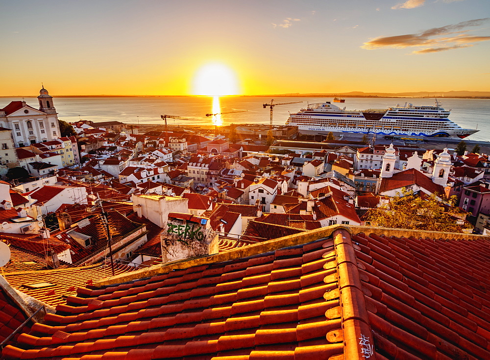 Miradouro das Portas do Sol, view over Alfama Neighbourhood towards the Tagus River at sunrise, Lisbon, Portugal, Europe