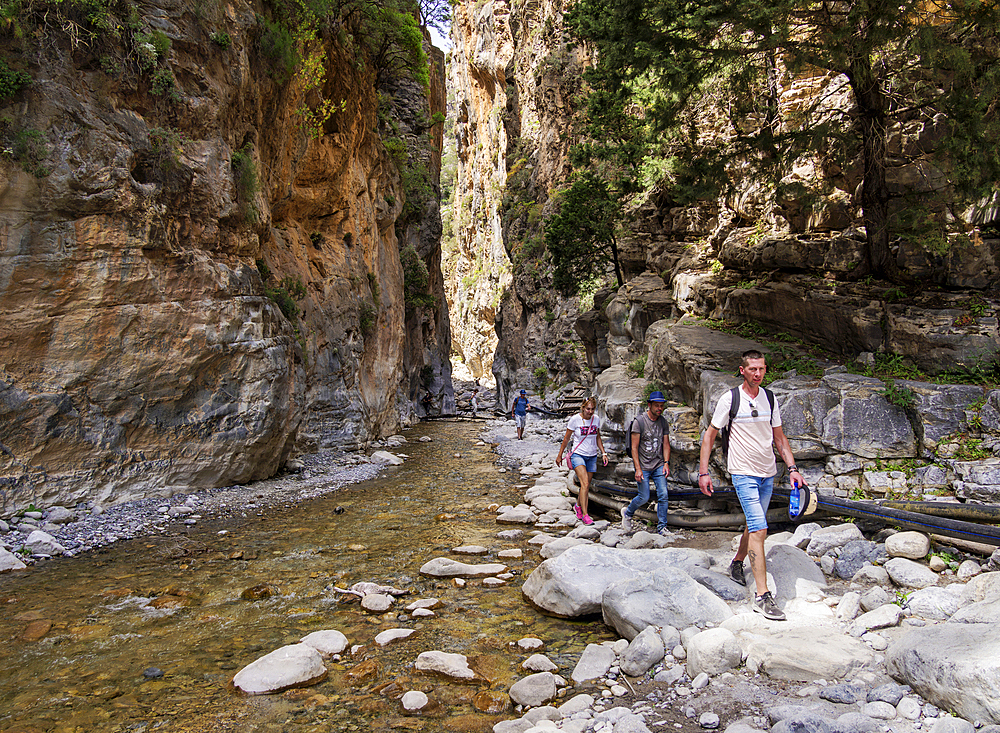 People trekking through the Gates, Samaria Gorge, Chania Region, Crete, Greek Islands, Greece, Europe