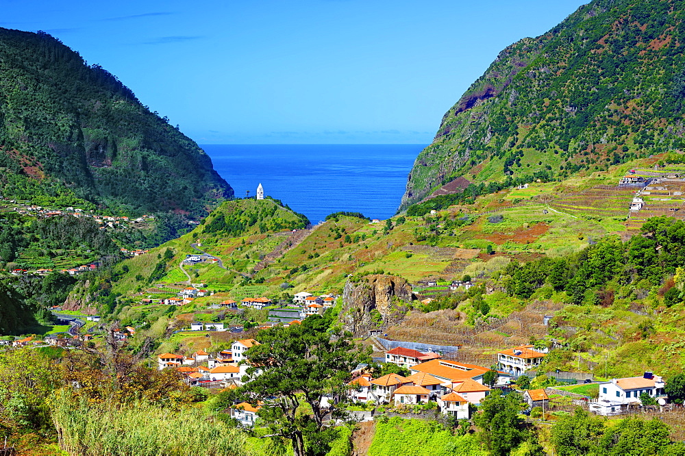 A distant view of Tower Chapel, Capela de Nossa Senhora de Fatima, looking towards Sao Vicente and the Atlantic Ocean, Madeira, Portugal, Atlantic, Europe