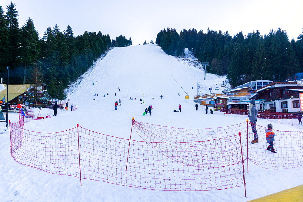 People sledging and enjoying the snow, Borovets Ski Resort, Bulgaria, Europe