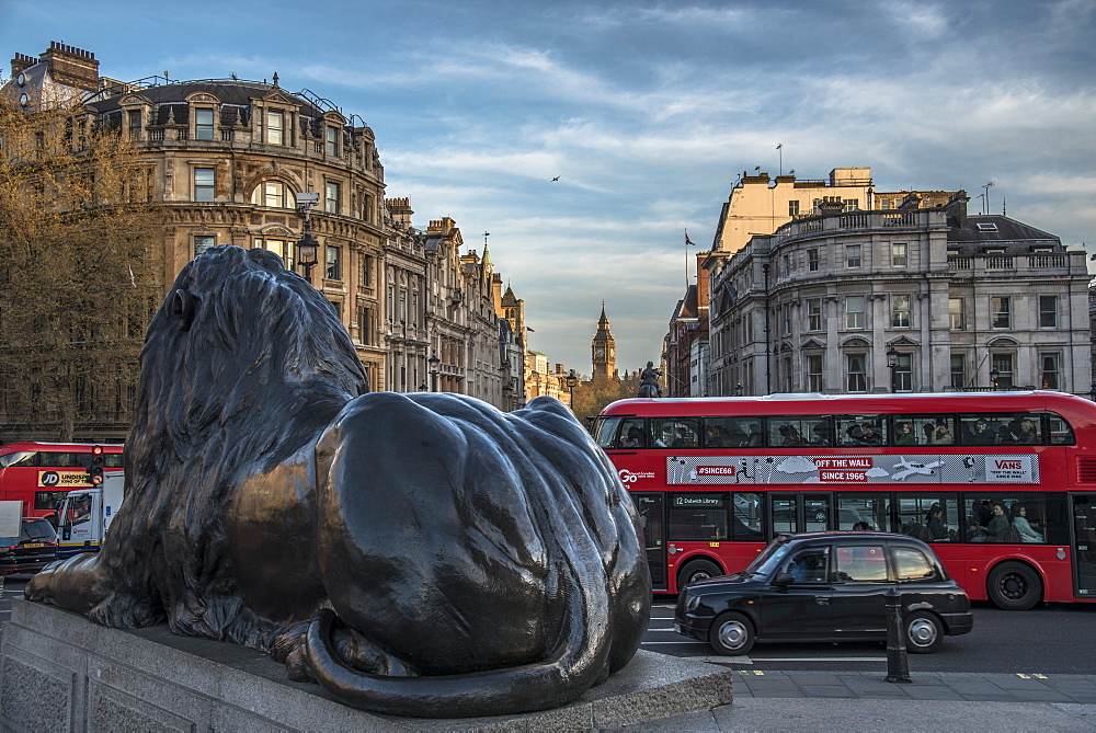 Landseer lion statue and double decker bus, London icons at Trafalgar Square, London, England, United Kingdom, Europe