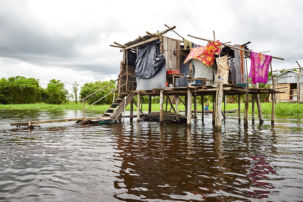 Wooden house on stilts in a flooded area of Iquitos, Peru, South America