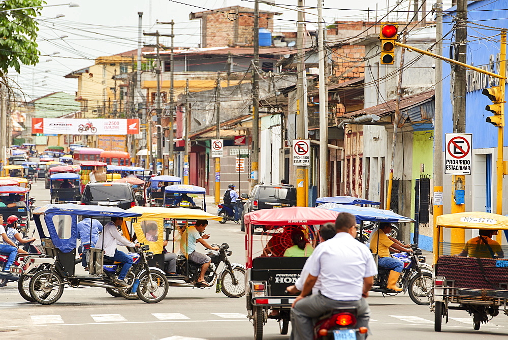 Mototaxis in a busy street in Iquitos, Peru, South America