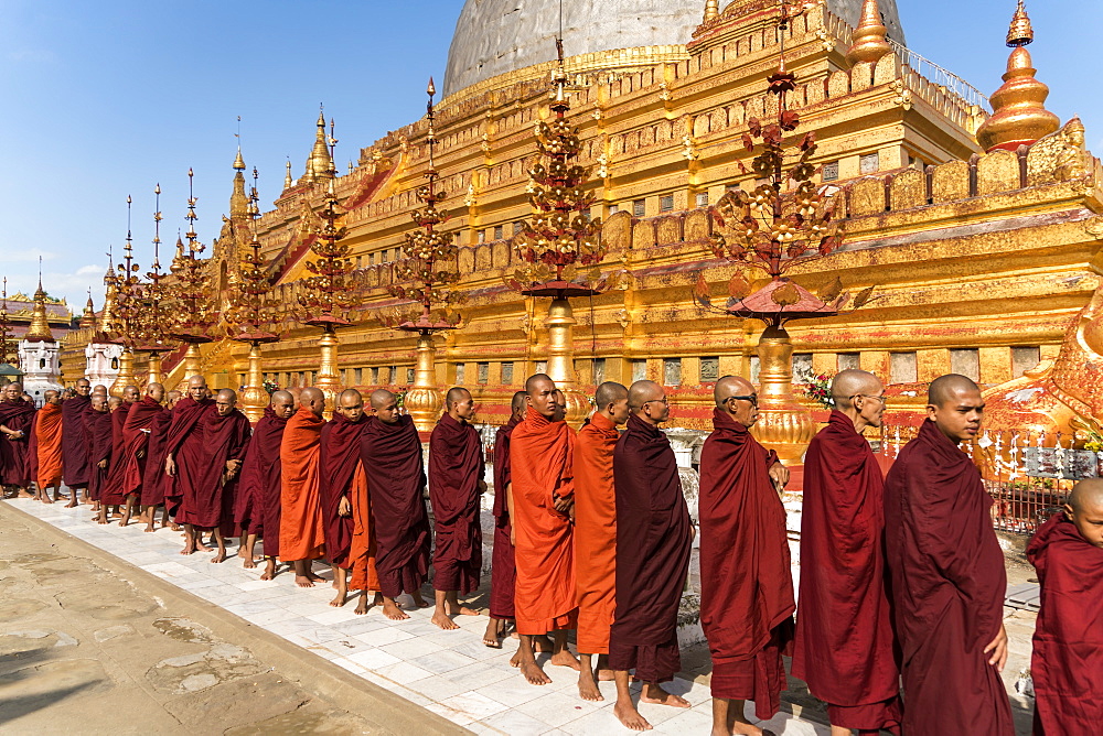 Monks at the Shwezigon Pagoda, Bagan (Pagan), Myanmar (Burma), Asia