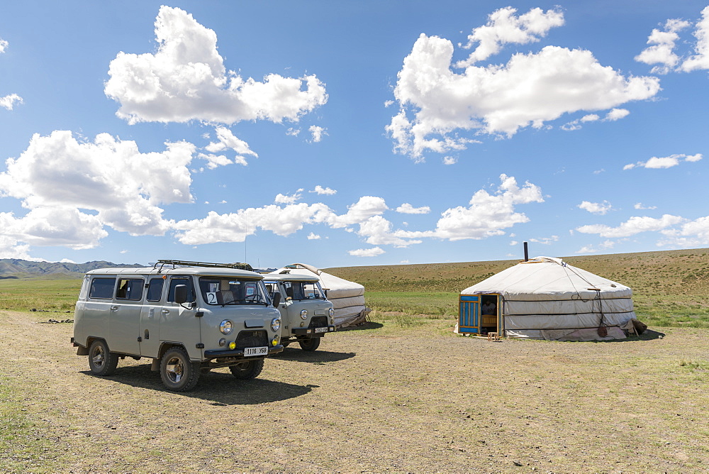 Mongolian traditional nomadic gers and soviet minivans. Bayandalai district, South Gobi province, Mongolia, Central Asia, Asia