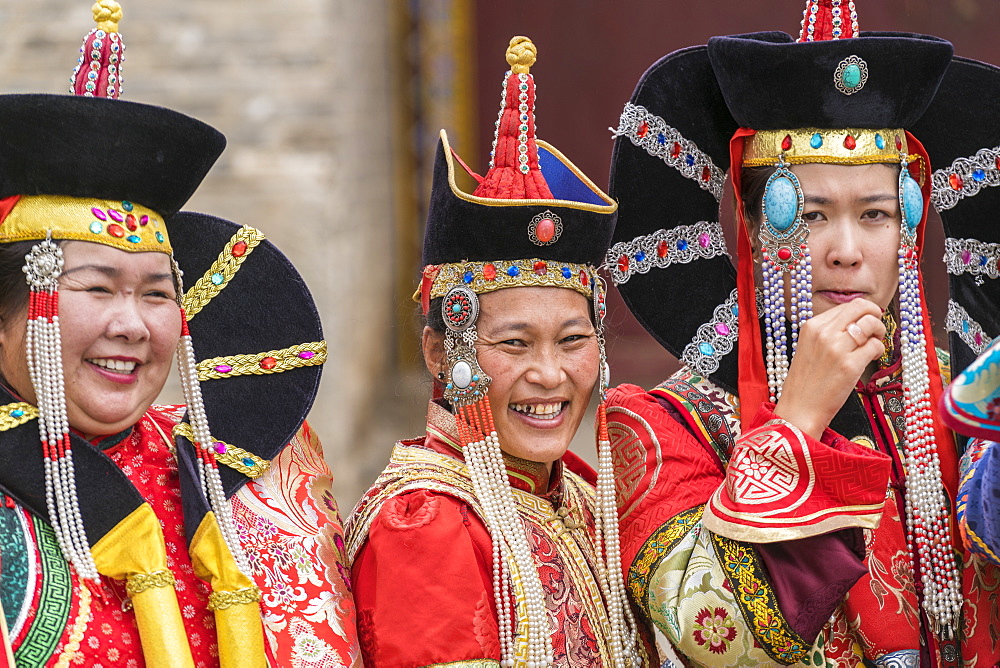 Three women wearing traditional Mongolian costumes, Harhorin, South Hangay province, Mongolia, Central Asia, Asia