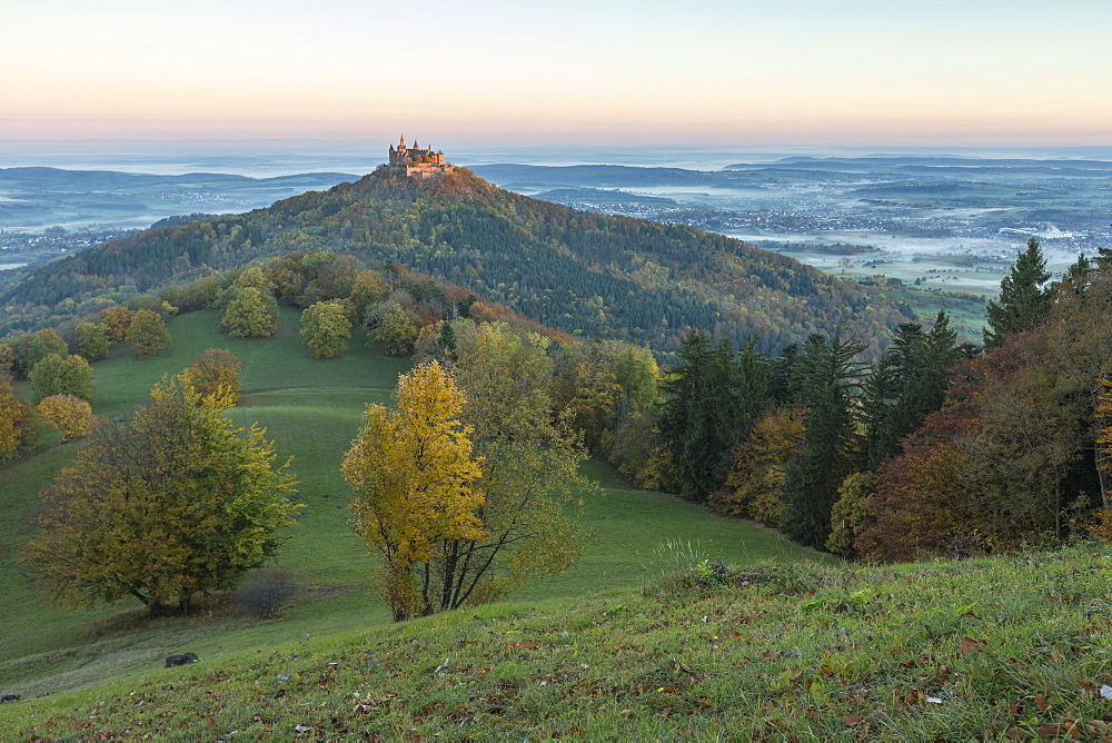 Hohenzollern Castle in autumnal scenery at dawn, Hechingen, Baden-Wurttemberg, Germany, Europe