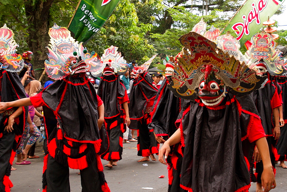 Indonesian men in masks taking part in a carnival celebrating Malang's 101st year anniversary, Malang, East Java, Indonesia, Southeast Asia, Asia