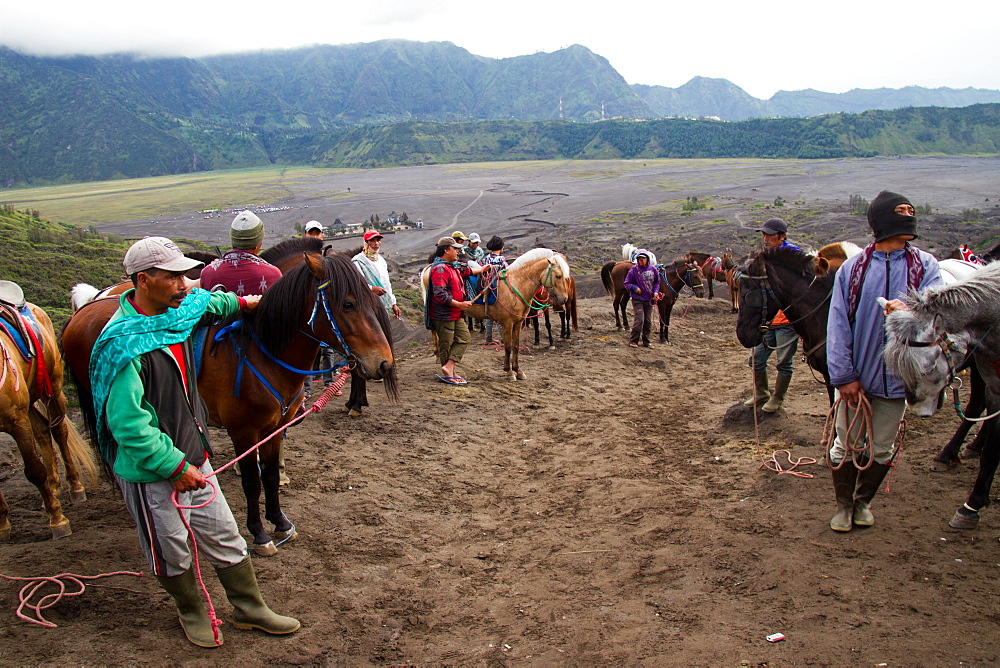 Horsemen on Mount Bromo volcano, Eastern Java, Indonesia, Southeast Asia, Asia