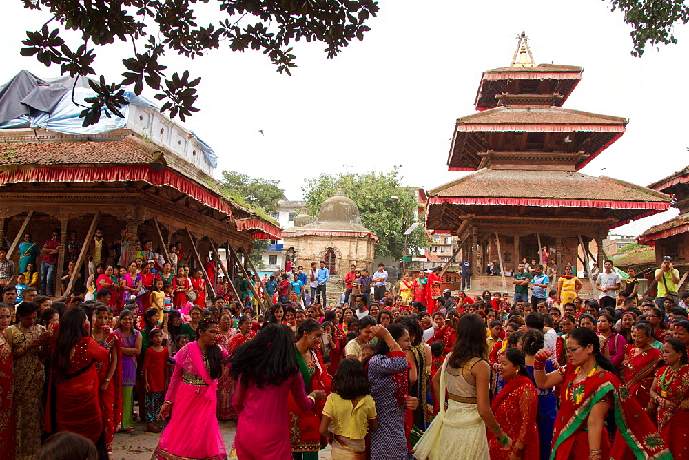 Women of Nepal celebrate Teej, a festival which blesses the men in their lives, Durbar Square, Kathmandu, Nepal, Asia