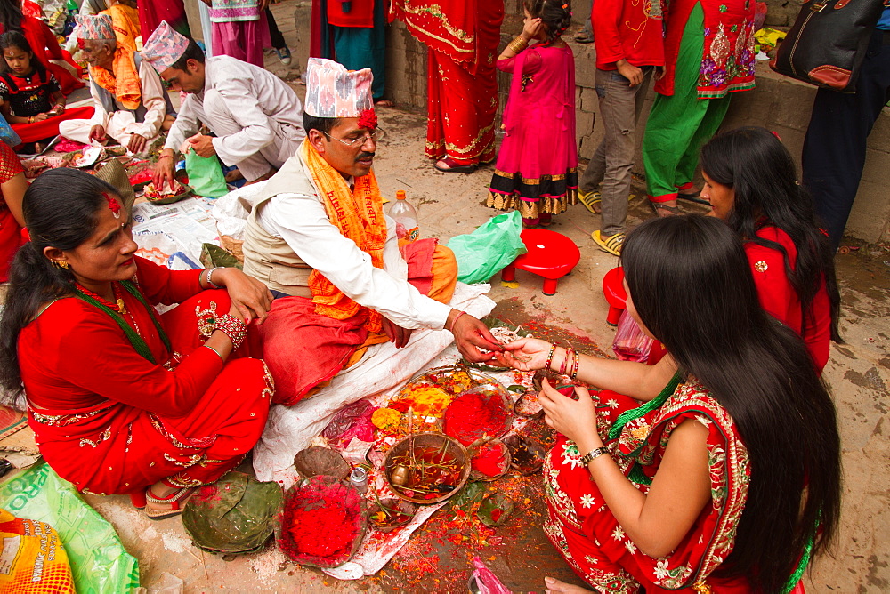 Women of Nepal celebrate Teej, a festival which blesses the men in their lives, Durbar Square, Kathmandu, Nepal, Asia