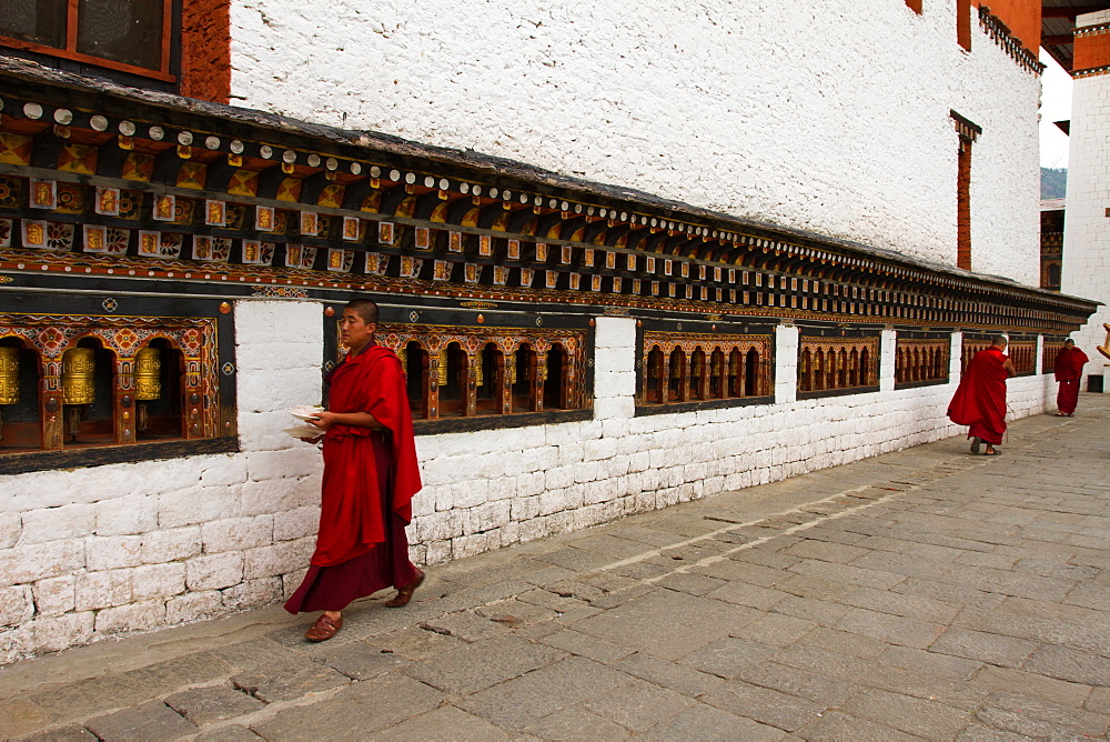 Monks and prayer wheels, Tashi Chho Dzong Fortress, Thimpu, Bhutan, Asia