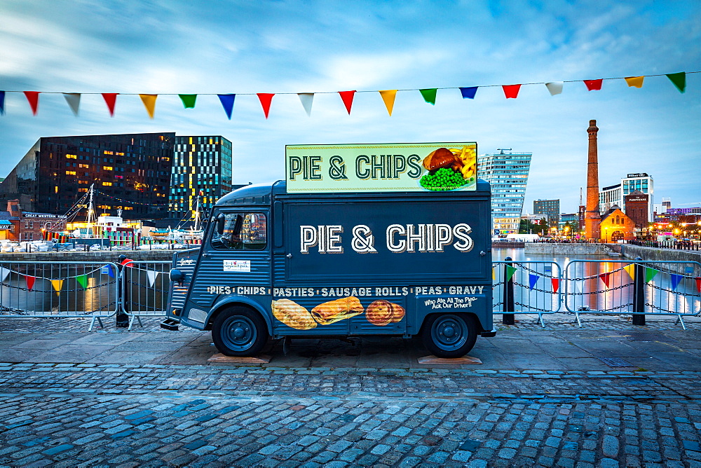 A Pie & Chips food van at the Albert Dock site on the River Mersey waterfront during the evening twilight (blue hour), Liverpool, Merseyside, England, United Kingdom, Europe.