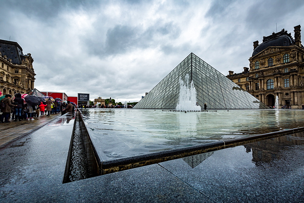 The large pyramid in the main courtyard and the main entrance to the Louvre Museum, Paris, France, Europe