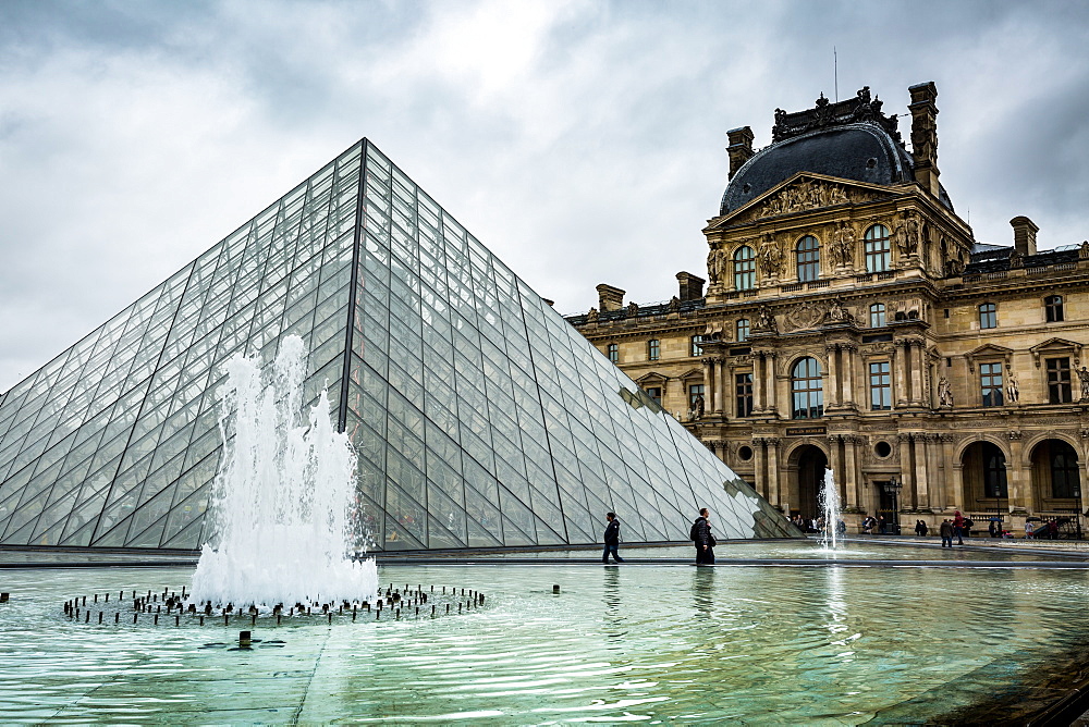 The large pyramid sits in the main courtyard and is the main entrance to the Louvre Museum, Paris, France, Europe