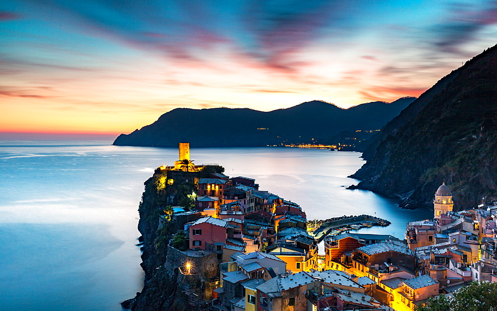 Long exposure at blue hour to capture the end of a stunning sunset and the lights of the old town, Vernazza, Cinque Terre, UNESCO World Heritage Site, Liguria, Italy, Europe