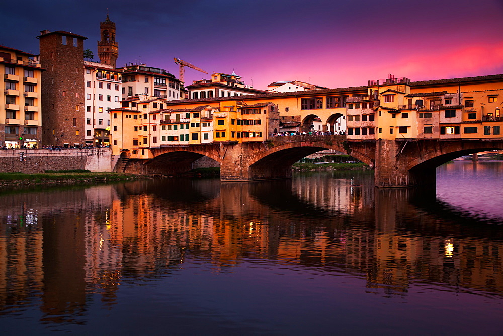 Ponte Vecchio at sunset reflected in the River Arno, Florence, UNESCO World Heritage Site, Tuscany, Italy, Europe