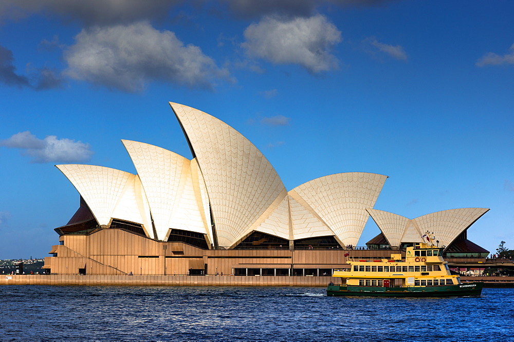 Ferry goes past the Sydney Opera House, UNESCO World Heritage Site, at Golden hour, Sydney, New South Wales, Australia, Pacific