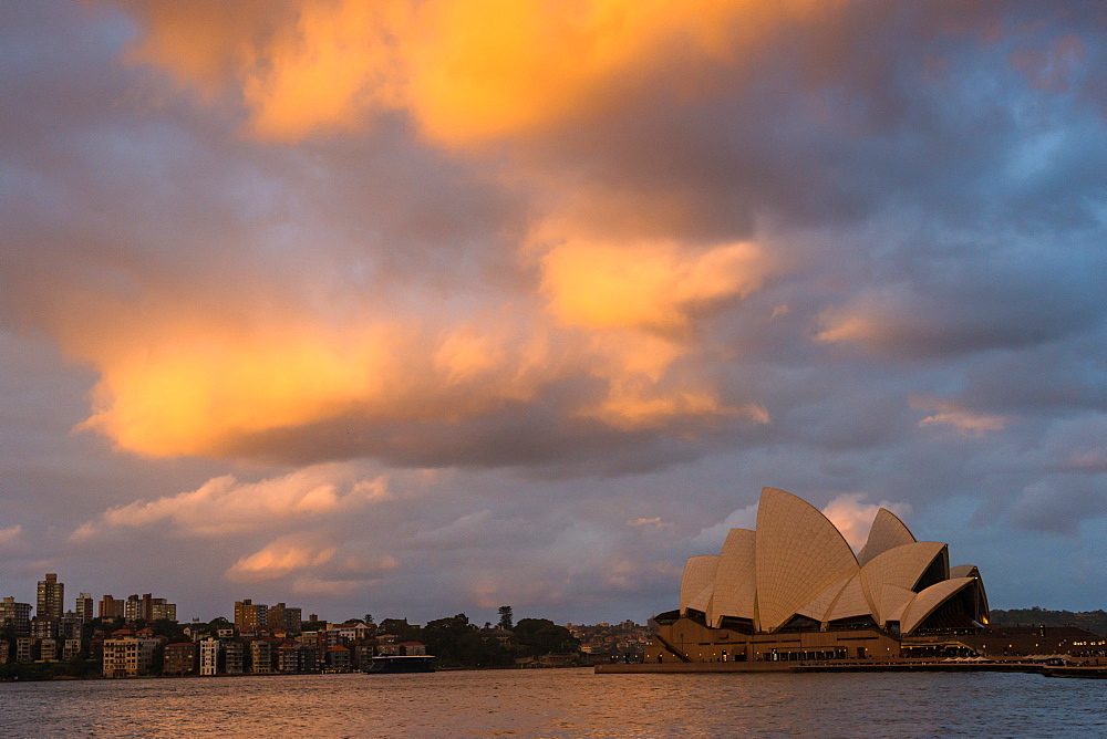 Sydney harbour with dramatic clouds as the sun sets, Sydney, New South Wales, Australia, Pacific