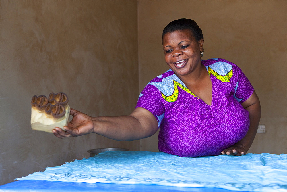 A woman making a new batik print, Tanzania, East Africa, Africa