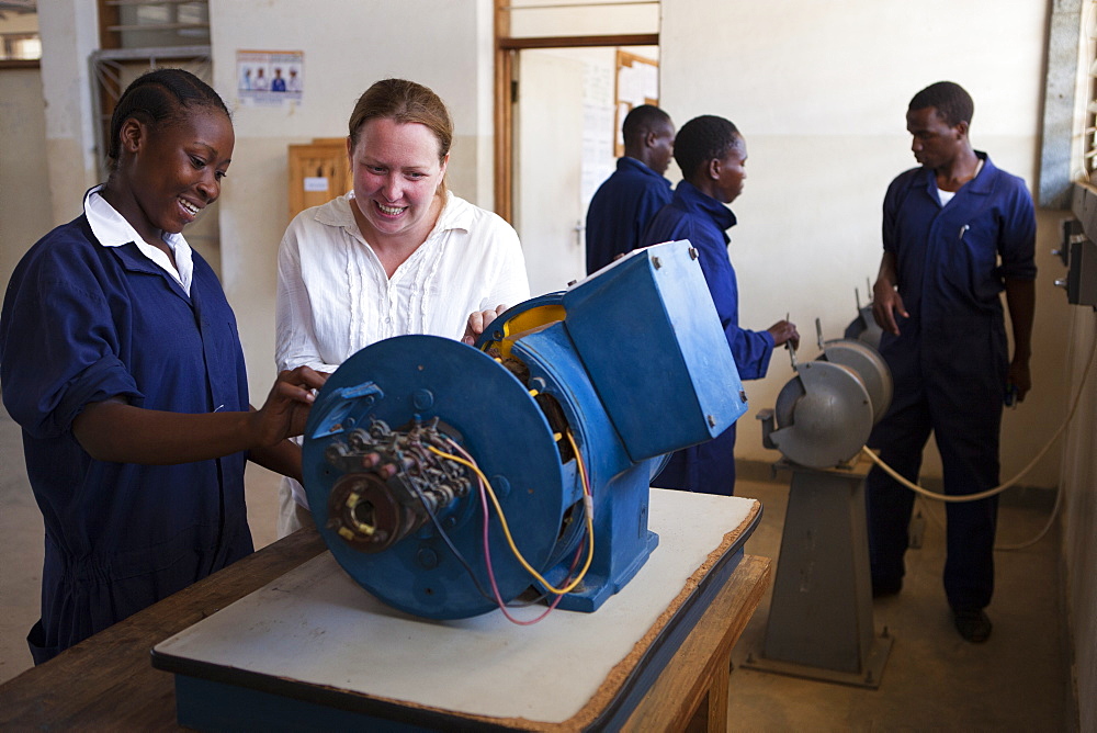 A VSO volunteer teaching a female electrician, Tanzania, East Africa, Africa