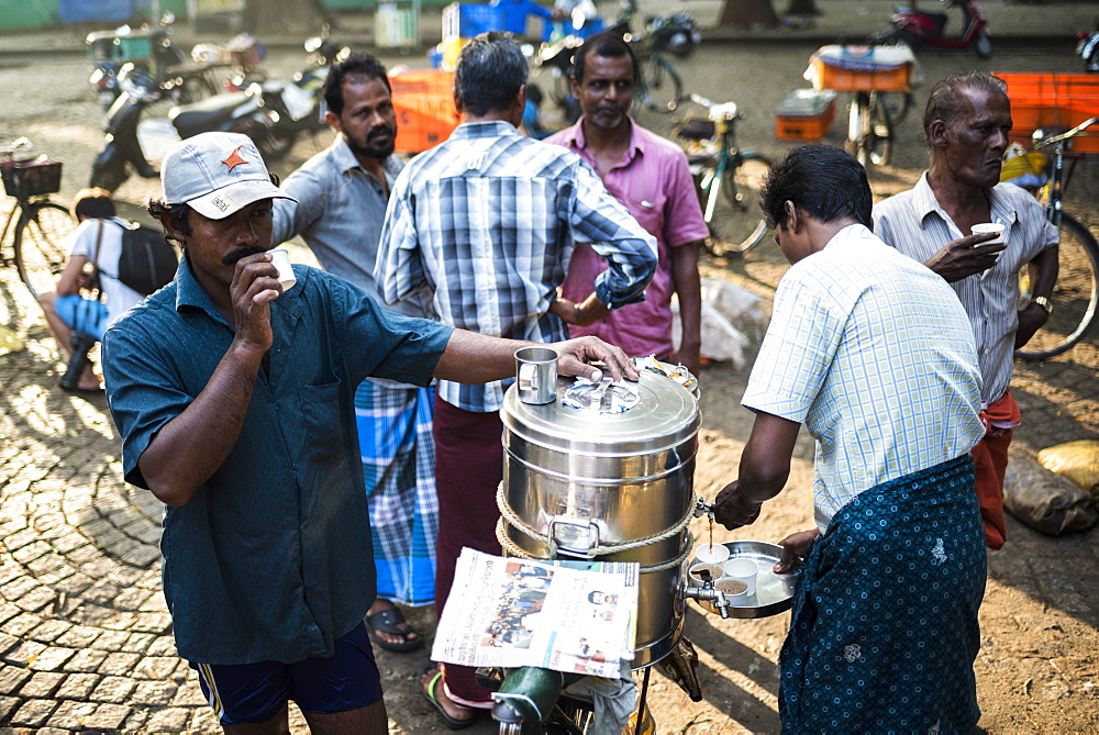 Chai Wallah serving tea at Fort Kochi (Cochin), Kerala, India, Asia