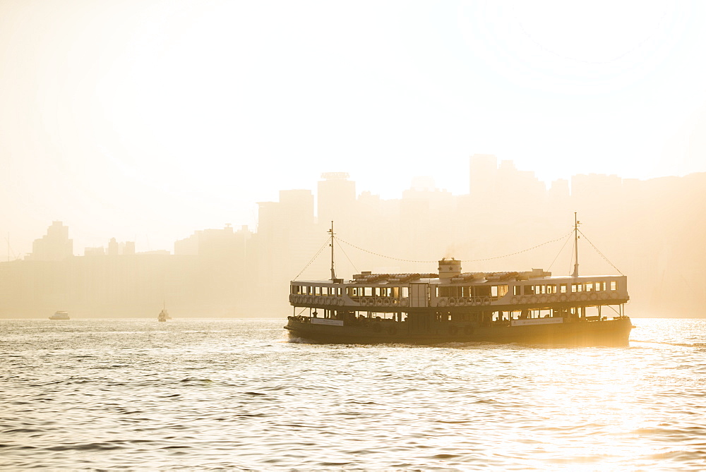 Star Ferry at sunset, between Hong Kong Island and Kowloon, Hong Kong, China, Asia