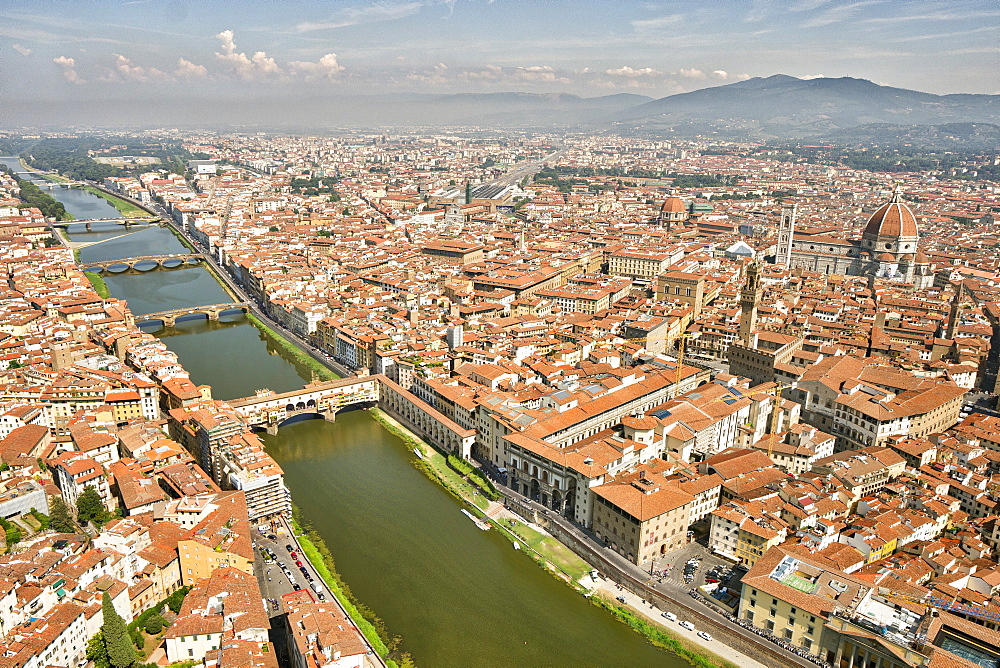 Aerial view of Florence with in the foreground Ponte Vecchio, Palazzo Vecchio and Cattedrale di Santa Maria del Fiore, Florence, Tuscany, Italy, Europe