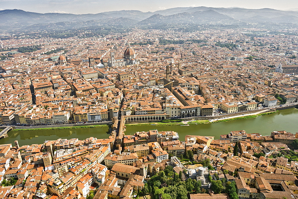 Aerial view of Florence with in the foreground Ponte Vecchio, Palazzo Vecchio and Cattedrale di Santa Maria del Fiore, Florence, Tuscany, Italy, Europe