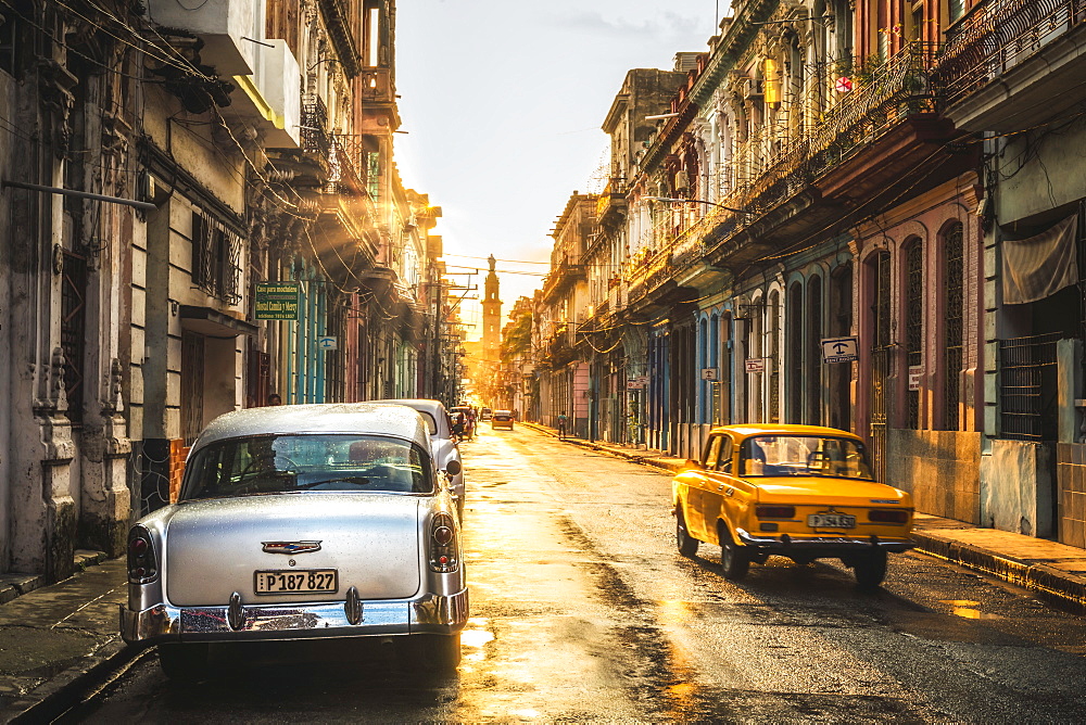 American and Russian vintage cars at sunset, La Habana (Havana), Cuba, West Indies, Caribbean, Central America