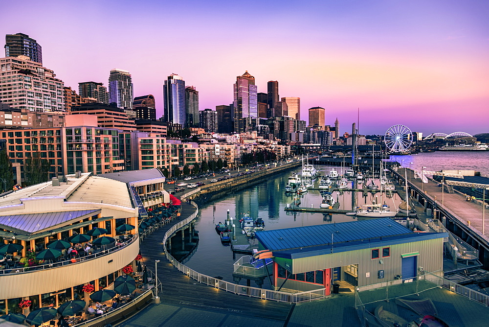 Sunset over Bell Harbor Marina on the Seattle Waterfront with city's skyline in the background, Seattle, Washington State, United States of America, North America