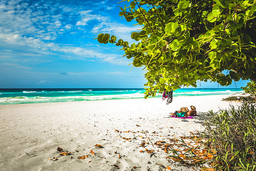 Tourists looking into the sea from Varadero beach, Hicacos Peninsula, Matanzas Province, Cuba, West Indies, Central America