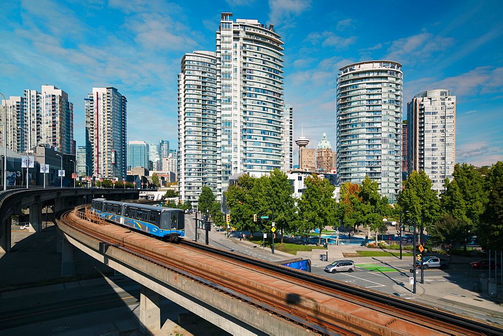 View of Sky Train and urban office blocks and apartments, Vancouver, British Columbia, Canada, North America