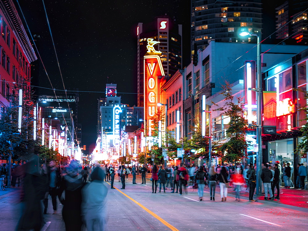 People having fun on Friday night on Granville Street, Orpheum Theatre visible in the background, Vancouver, British Columbia, Canada, North America