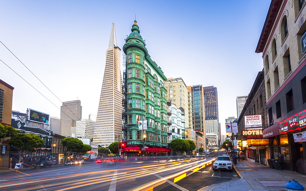 View of Transamerica Pyramid building on Columbus Avenue and car trail lights, San Francisco, California, United States of America, North America